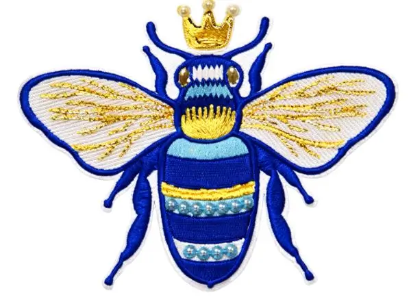 Embroidered blue bee patch featuring metallic gold thread wings and a crown, embellished with pearl beads on the body.