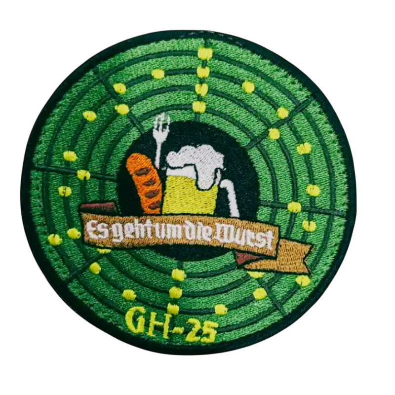 Round green embroidered patch resembling a radar screen
