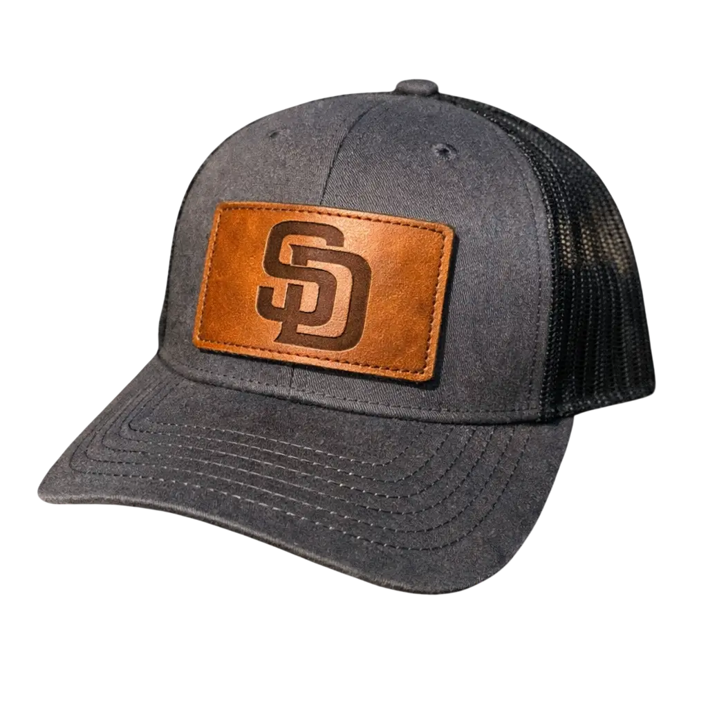 Charcoal grey trucker hat featuring a custom genuine leather patch with a laser-engraved San Diego 'SD' logo.