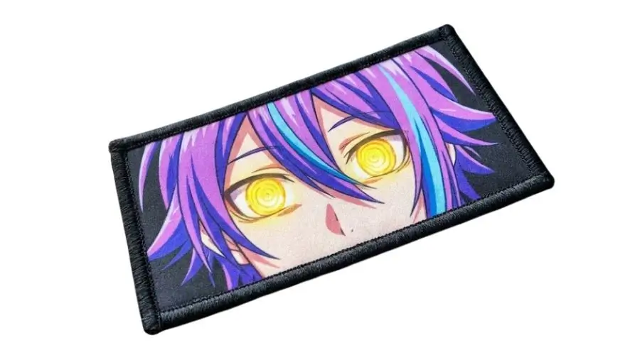 Sublimated anime patch featuring vibrant purple hair and glowing yellow eyes with a black merrowed edge.