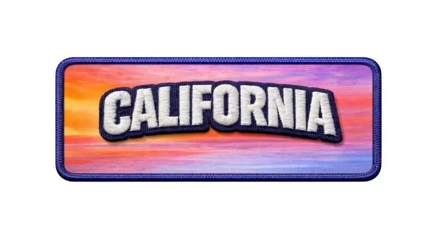 Custom hybrid patch featuring a printed sunset background with raised 3D puff embroidery text.