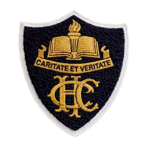 Navy blue school crest patch featuring embroidery over chenille background.