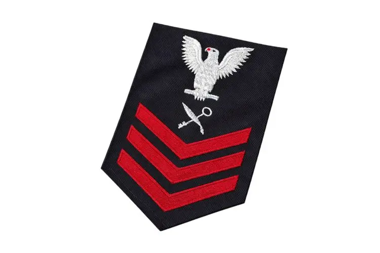 Embroidered U.S. Navy IS1 Intelligence Specialist Petty Officer First Class rating badge.
